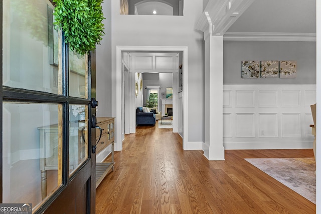 55 Jolie Ln, Sharpsburg, GA 30277 - entrance foyer featuring ornamental molding, wood finished floors, and a fireplace