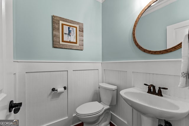55 Jolie Ln, Sharpsburg, GA 30277 - bathroom with wainscoting and a sink