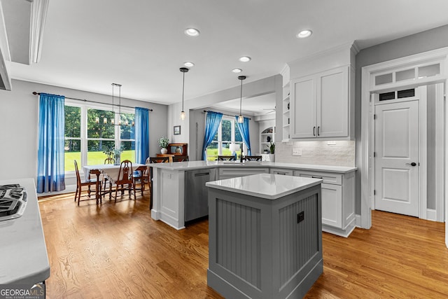 55 Jolie Ln, Sharpsburg, GA 30277 - kitchen featuring stainless steel dishwasher, a peninsula, light countertops, recessed lighting, and white cabinets