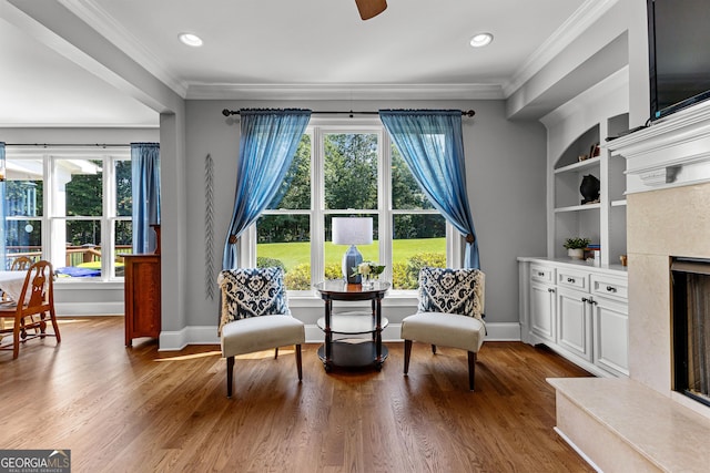 55 Jolie Ln, Sharpsburg, GA 30277 - living area featuring plenty of natural light, ornamental molding, a fireplace, wood finished floors, and recessed lighting