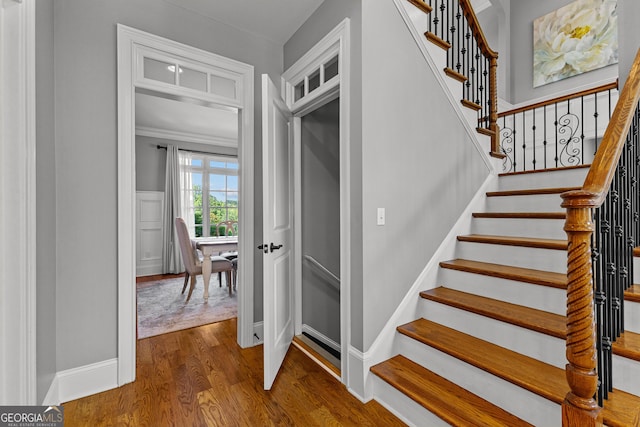 55 Jolie Ln, Sharpsburg, GA 30277 - stairway featuring wood finished floors and baseboards