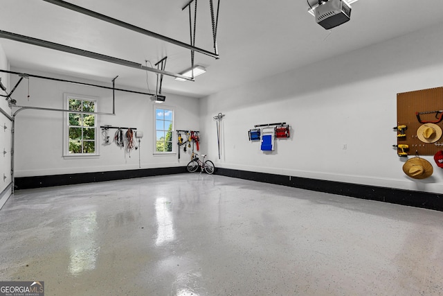 55 Jolie Ln, Sharpsburg, GA 30277 - garage featuring a garage door opener