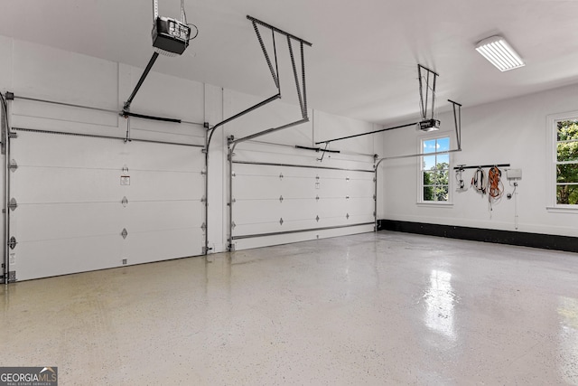 55 Jolie Ln, Sharpsburg, GA 30277 - garage featuring a garage door opener
