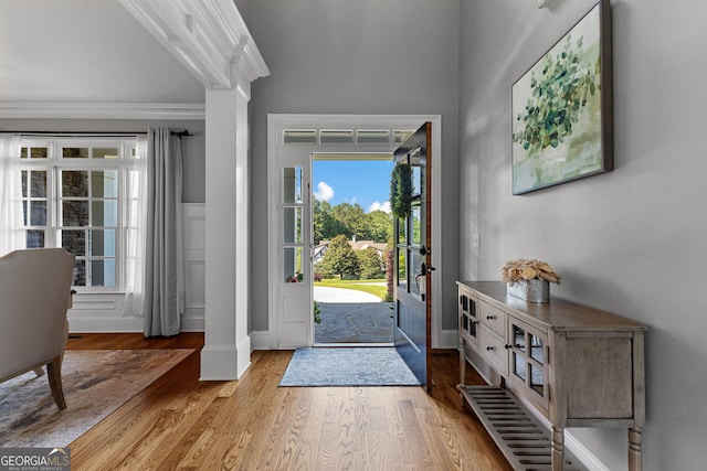 55 Jolie Ln, Sharpsburg, GA 30277 - foyer with ornamental molding, wood finished floors, and decorative columns