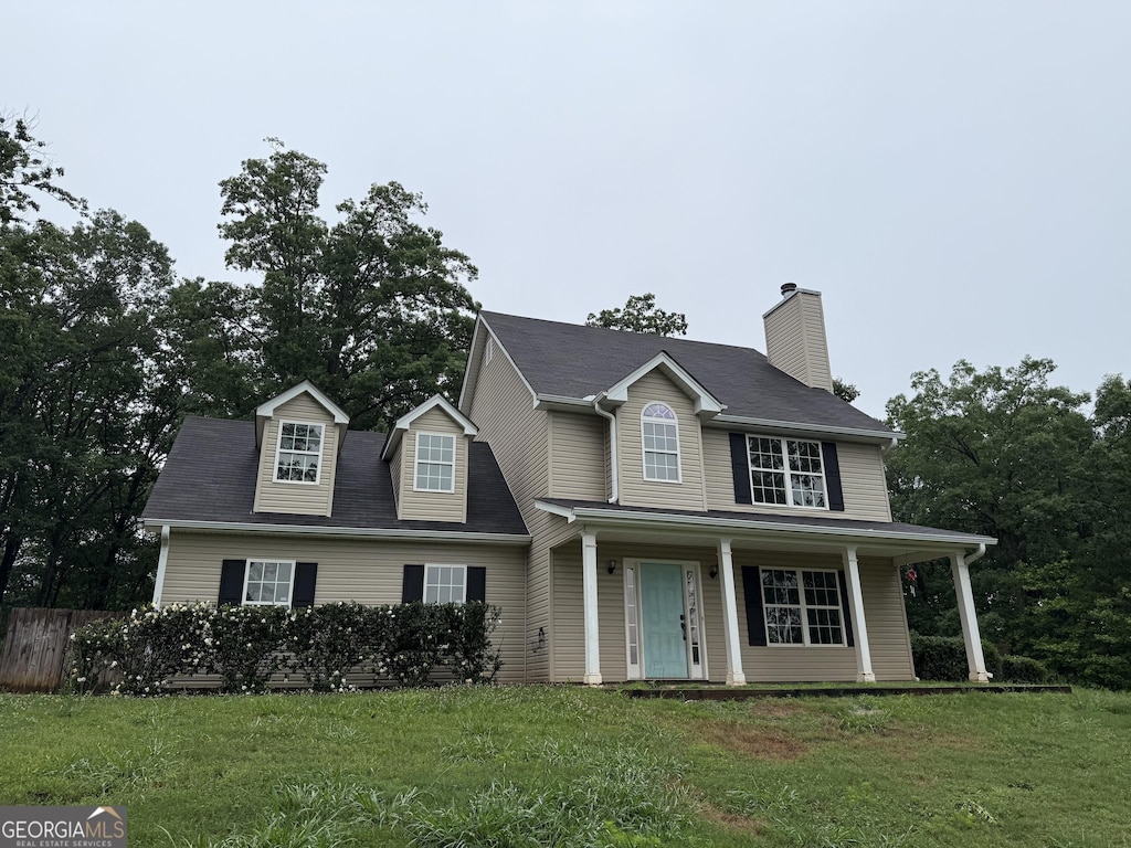 3455 Navigator Ln, Gainesville, GA 30507 - view of front of house with a front yard, a chimney, and covered porch