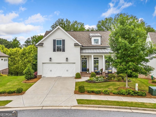 309 Mcdaniel Pl, Canton, GA 30115 - view of front of property with a garage, driveway, a standing seam roof, covered porch, and roof with shingles