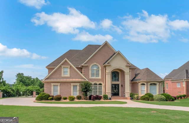 413 Canterbury Way, Jonesboro, GA 30236 - view of front facade with a front lawn and brick siding