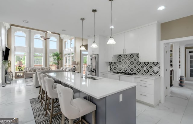 413 Canterbury Way, Jonesboro, GA 30236 - kitchen featuring stainless steel fridge with ice dispenser, a sink, open floor plan, recessed lighting, and tasteful backsplash