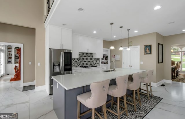 413 Canterbury Way, Jonesboro, GA 30236 - kitchen with stainless steel fridge, a sink, recessed lighting, decorative backsplash, and baseboards