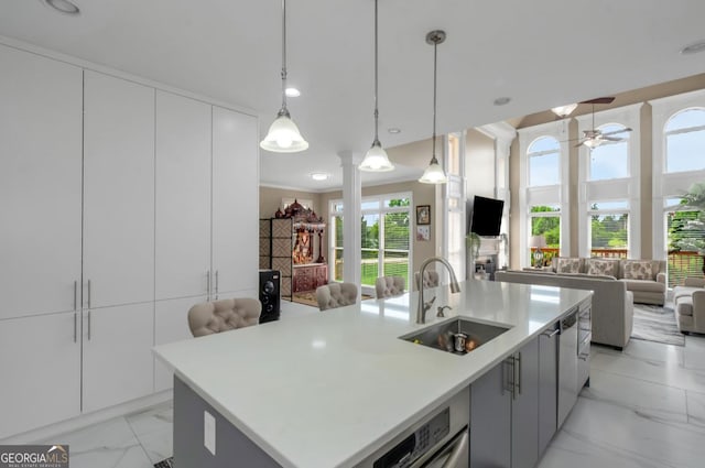 413 Canterbury Way, Jonesboro, GA 30236 - kitchen with a sink, open floor plan, light marble finish flooring, and healthy amount of natural light