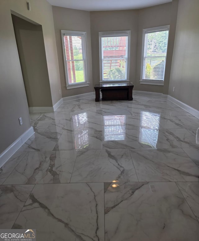 413 Canterbury Way, Jonesboro, GA 30236 - unfurnished room featuring baseboards and marble tiled floors