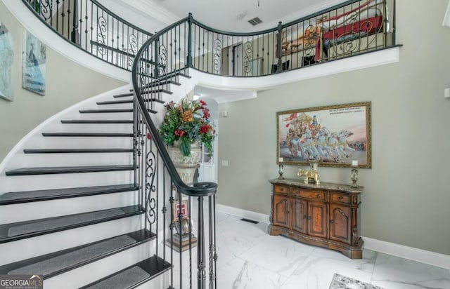 413 Canterbury Way, Jonesboro, GA 30236 - staircase with marble finish floors, baseboards, and a towering ceiling