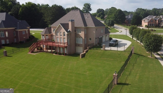 413 Canterbury Way, Jonesboro, GA 30236 - back of house featuring stairway, a deck, driveway, an attached garage, and a chimney