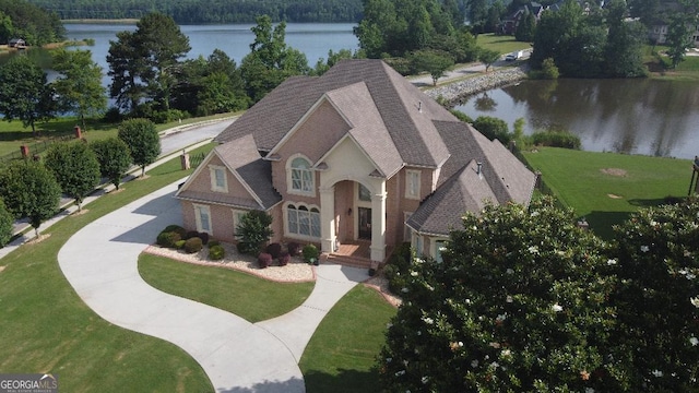413 Canterbury Way, Jonesboro, GA 30236 - view of front of home featuring a water view, a front yard, and roof with shingles