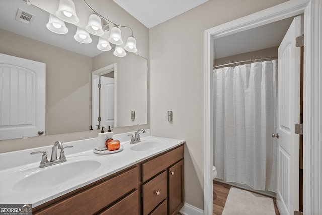 2118 Harmony Dr, Canton, GA 30115 - bathroom featuring double vanity, a shower with shower curtain, and wood finished floors