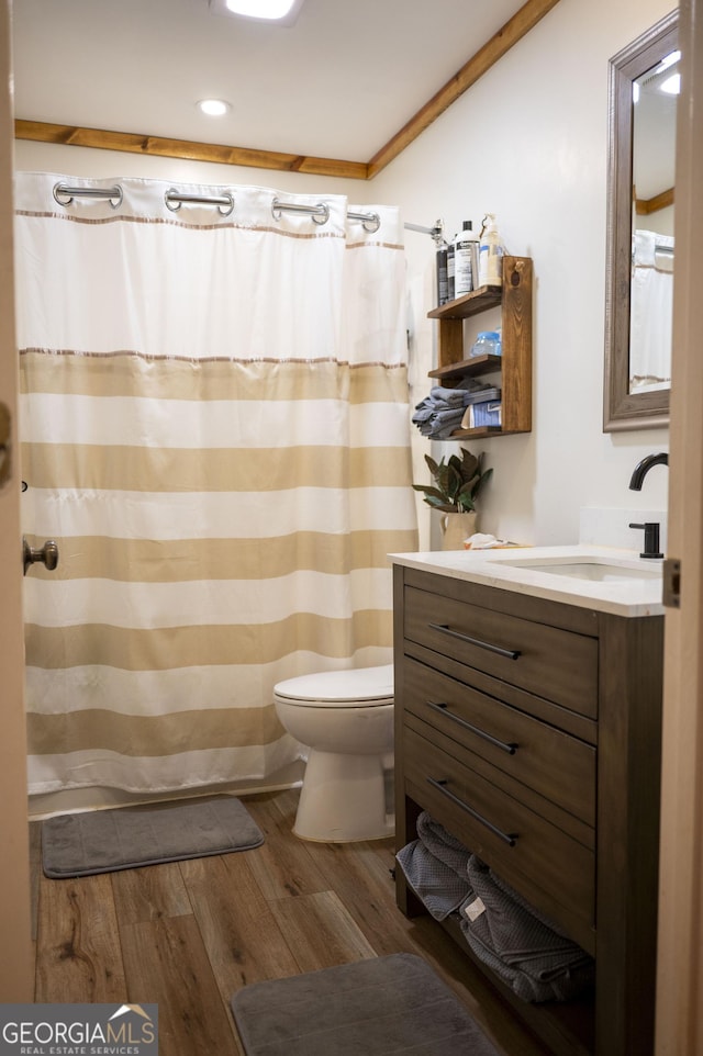 323 Mccartan Trl, Clarkesville, GA 30523 - bathroom featuring vanity, wood finished floors, toilet, recessed lighting, and crown molding