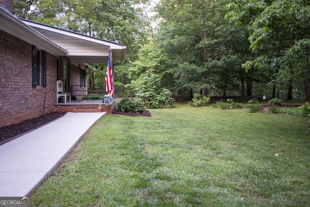323 Mccartan Trl, Clarkesville, GA 30523 - view of grassy yard with a porch
