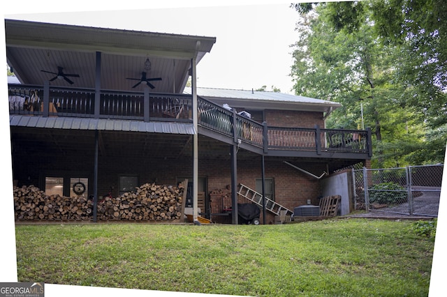 323 Mccartan Trl, Clarkesville, GA 30523 - back of property with a ceiling fan, a yard, brick siding, a wooden deck, and a gate