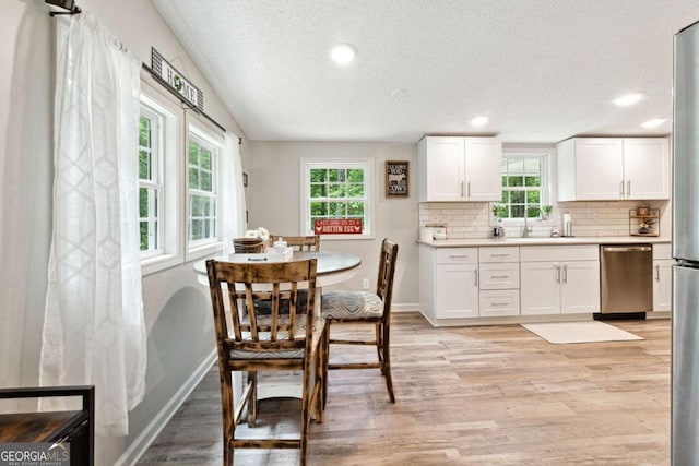 187 Angers Ct, Dahlonega, GA 30533 - dining area featuring a textured ceiling, light wood-style flooring, recessed lighting, and baseboards