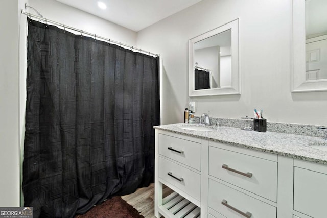 187 Angers Ct, Dahlonega, GA 30533 - bathroom with double vanity, wood finished floors, and curtained shower