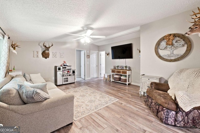 187 Angers Ct, Dahlonega, GA 30533 - living area featuring light wood-type flooring, a textured ceiling, ceiling fan, and baseboards