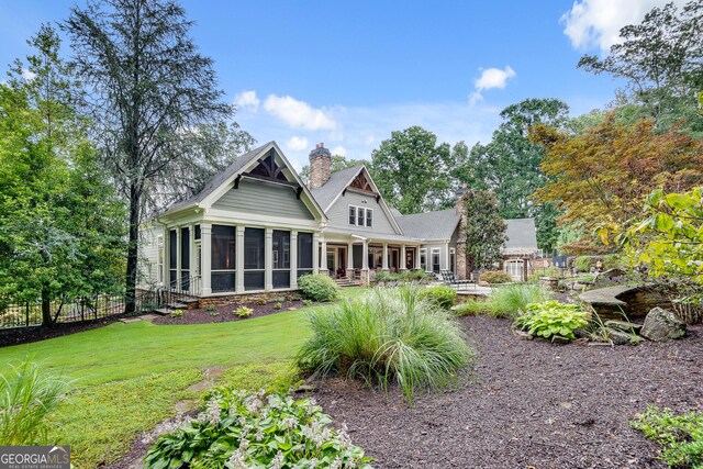 114 Trinity Hollow Dr, Canton, GA 30115 - back of house featuring a sunroom and a chimney
