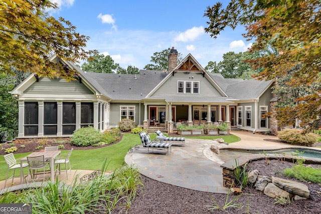 114 Trinity Hollow Dr, Canton, GA 30115 - back of house featuring a patio area, a chimney, a sunroom, and a shingled roof