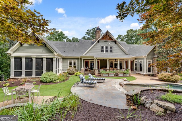 114 Trinity Hollow Dr, Canton, GA 30115 - back of property with a patio area, a chimney, and a sunroom