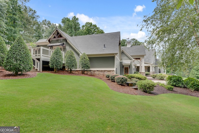 114 Trinity Hollow Dr, Canton, GA 30115 - craftsman-style home with a front lawn, a shingled roof, and a wooden deck