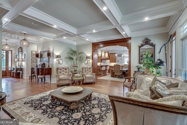 114 Trinity Hollow Dr, Canton, GA 30115 - living room featuring wood finished floors, coffered ceiling, beam ceiling, ornamental molding, and arched walkways