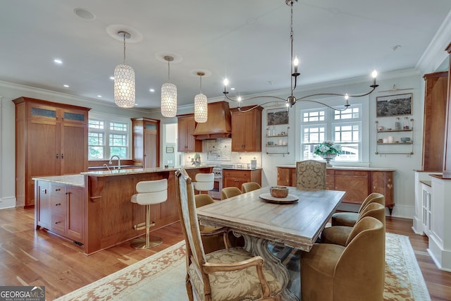 114 Trinity Hollow Dr, Canton, GA 30115 - dining space featuring a chandelier, crown molding, light wood finished floors, recessed lighting, and baseboards