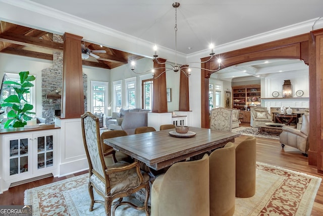114 Trinity Hollow Dr, Canton, GA 30115 - dining room featuring ornate columns, light wood-type flooring, ornamental molding, a ceiling fan, and beam ceiling