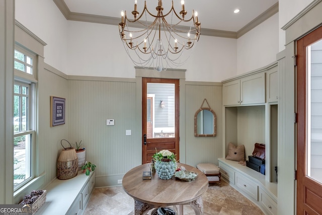 114 Trinity Hollow Dr, Canton, GA 30115 - mudroom featuring crown molding, a chandelier, a towering ceiling, and baseboards