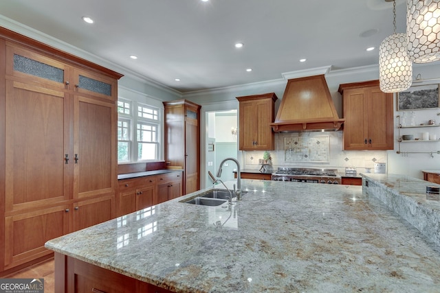 114 Trinity Hollow Dr, Canton, GA 30115 - kitchen with a sink, custom exhaust hood, brown cabinets, stove, and ornamental molding