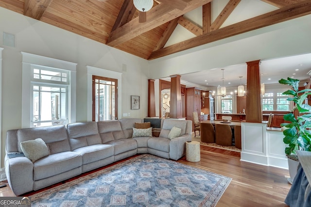 114 Trinity Hollow Dr, Canton, GA 30115 - living area with wood finished floors, ornate columns, a chandelier, wood ceiling with exposed beams, and high vaulted ceiling