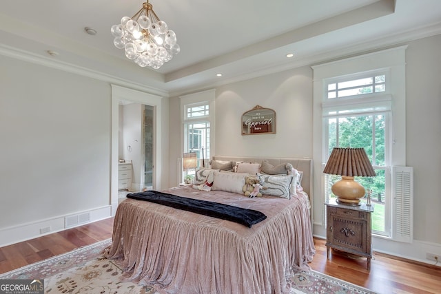 114 Trinity Hollow Dr, Canton, GA 30115 - bedroom featuring a tray ceiling, wood finished floors, crown molding, a chandelier, and recessed lighting