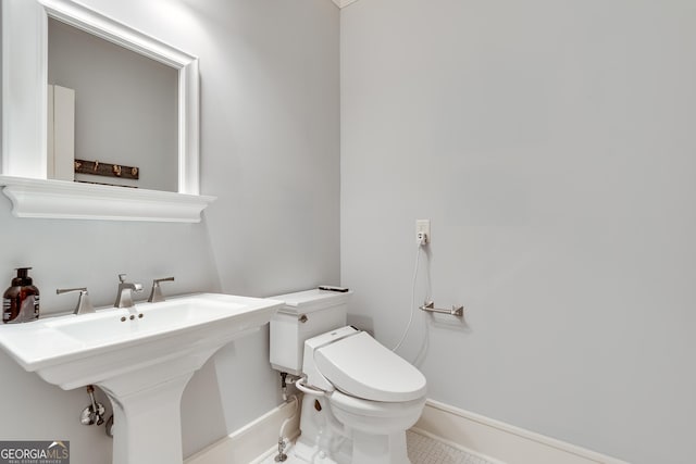 114 Trinity Hollow Dr, Canton, GA 30115 - bathroom with toilet, baseboards, and a sink