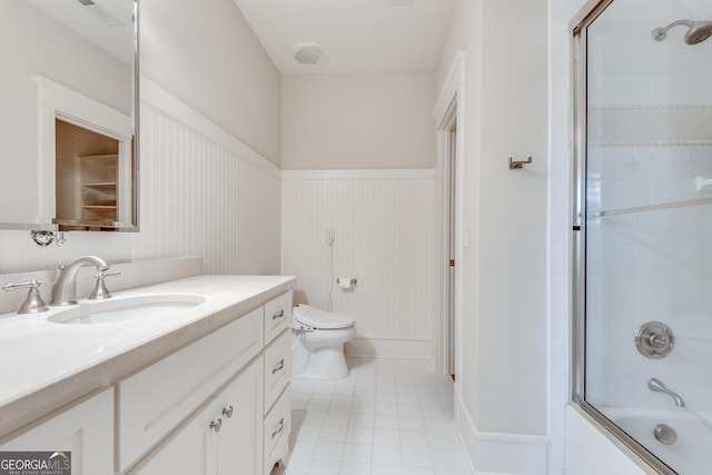 114 Trinity Hollow Dr, Canton, GA 30115 - full bath with vanity, tile patterned flooring, toilet, shower / bath combination with glass door, and a wainscoted wall