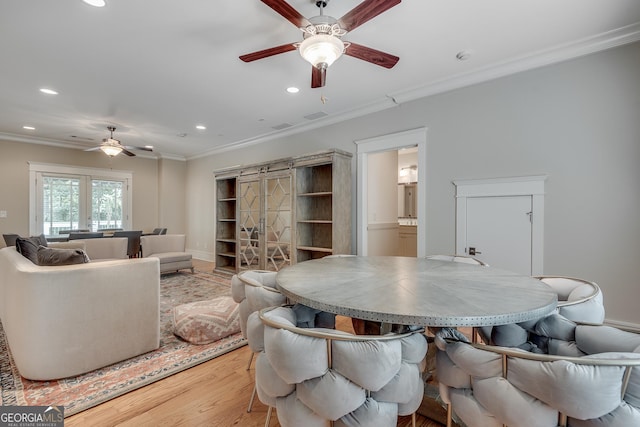 114 Trinity Hollow Dr, Canton, GA 30115 - dining area featuring ceiling fan, light wood finished floors, recessed lighting, ornamental molding, and a barn door