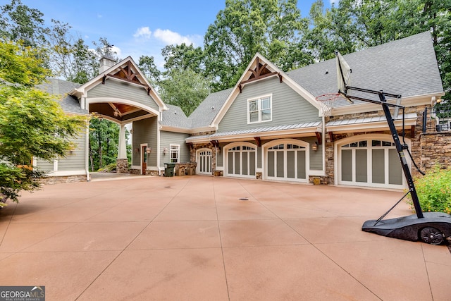 114 Trinity Hollow Dr, Canton, GA 30115 - view of front of house featuring a shingled roof, stone siding, and driveway