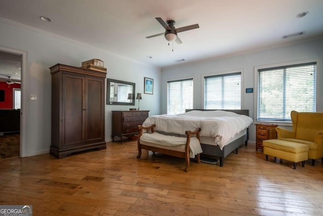 1079 Hardeman Farm Rd, Carnesville, GA 30521 - bedroom featuring light wood finished floors, ornamental molding, ceiling fan, and baseboards