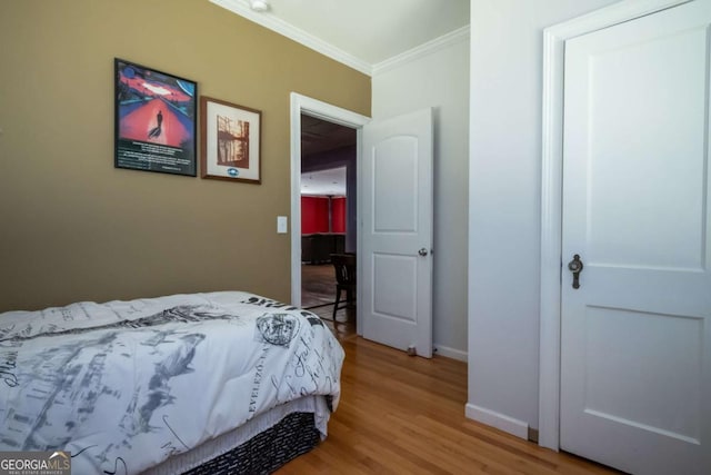 1079 Hardeman Farm Rd, Carnesville, GA 30521 - bedroom with ornamental molding, light wood finished floors, and baseboards