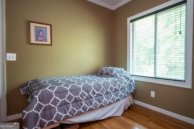 1079 Hardeman Farm Rd, Carnesville, GA 30521 - bedroom with crown molding, baseboards, and wood finished floors