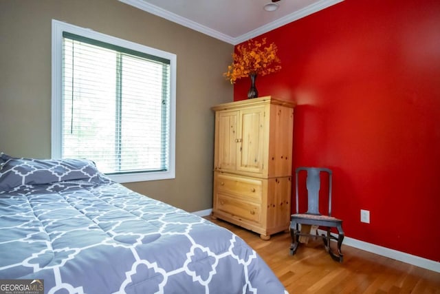 1079 Hardeman Farm Rd, Carnesville, GA 30521 - bedroom with multiple windows, light wood finished floors, crown molding, and baseboards