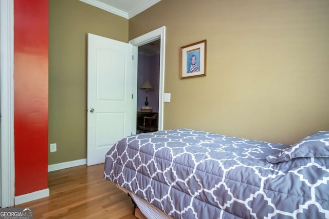 1079 Hardeman Farm Rd, Carnesville, GA 30521 - bedroom featuring ornamental molding, wood finished floors, and baseboards