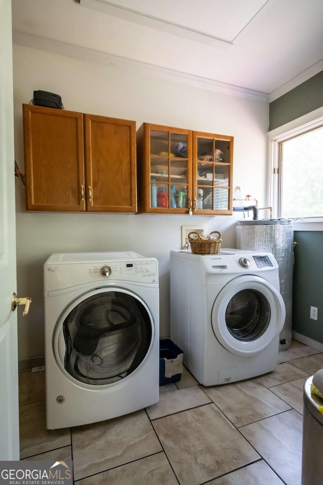 1079 Hardeman Farm Rd, Carnesville, GA 30521 - washroom featuring washing machine and dryer, cabinet space, and crown molding