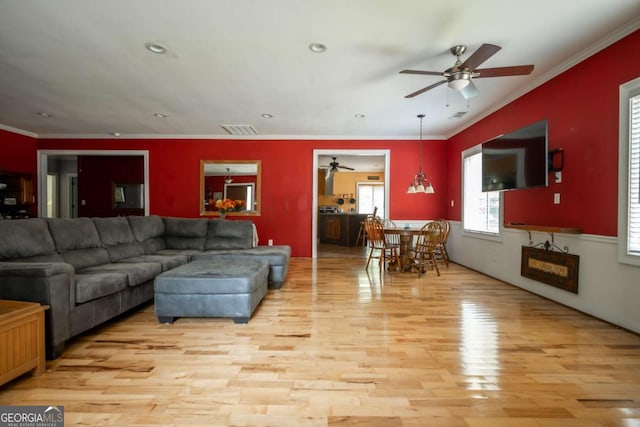 1079 Hardeman Farm Rd, Carnesville, GA 30521 - living room with ceiling fan, light wood-style floors, ornamental molding, and recessed lighting