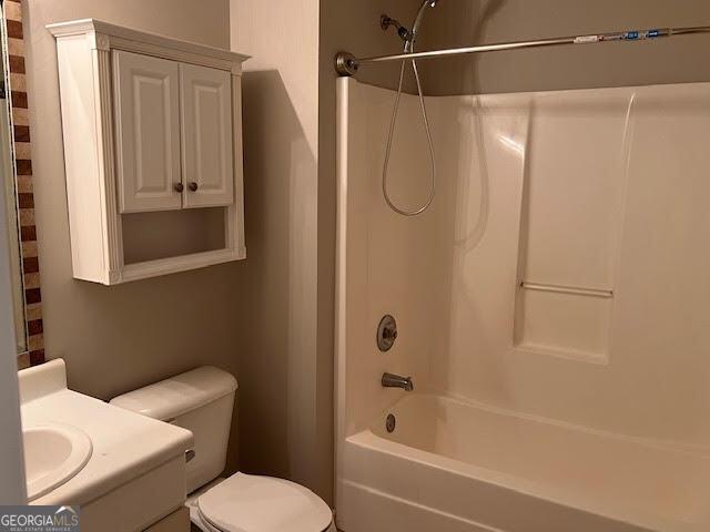 149 Titan Rd, Stockbridge, GA 30281 - bathroom with vanity, shower / washtub combination, and toilet