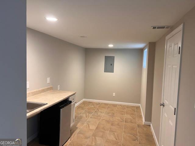 149 Titan Rd, Stockbridge, GA 30281 - basement with electric panel, recessed lighting, a sink, and baseboards
