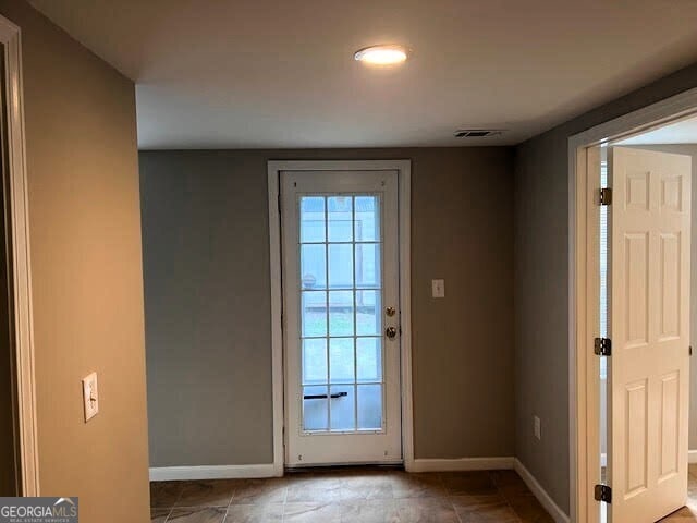 149 Titan Rd, Stockbridge, GA 30281 - doorway to outside with baseboards